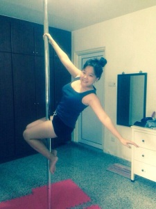 Eunice Lim, glamorously practicing pole dancing in her room with her new bought pole.